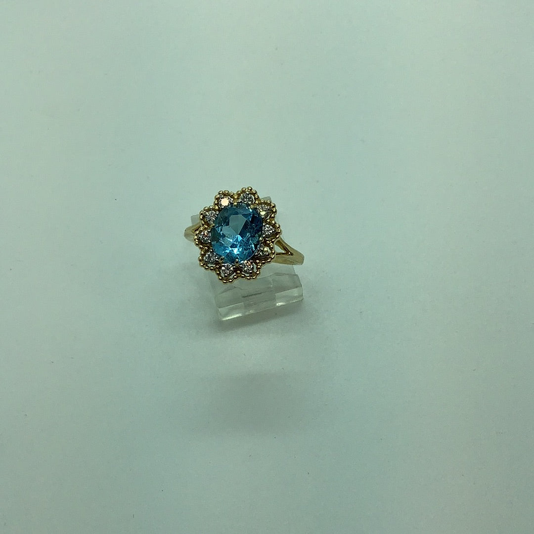 Blue topaz and diamond ring