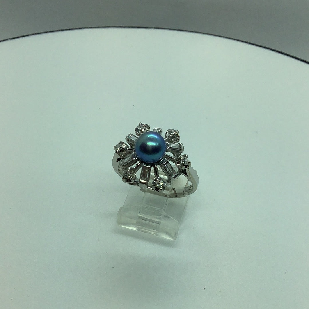 Black pearl and diamond ring