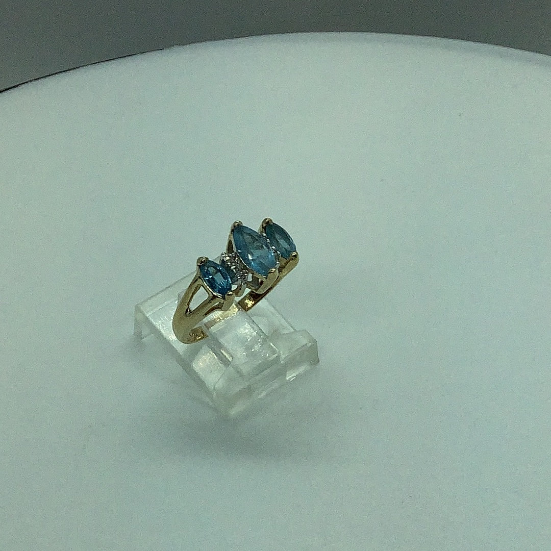 Blue topaz and diamond ring