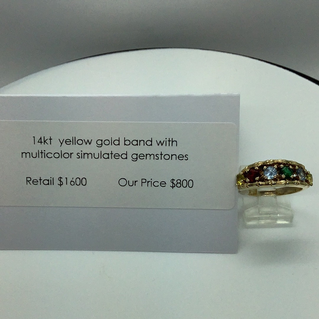 Gold band with simulated gemstones