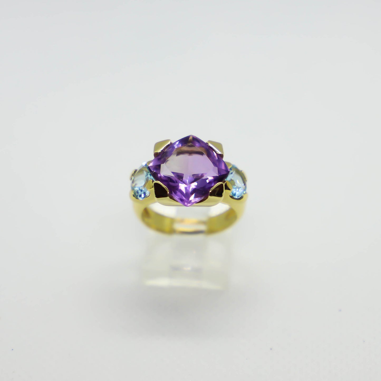 Yellow gold amethyst and blue topaz ring