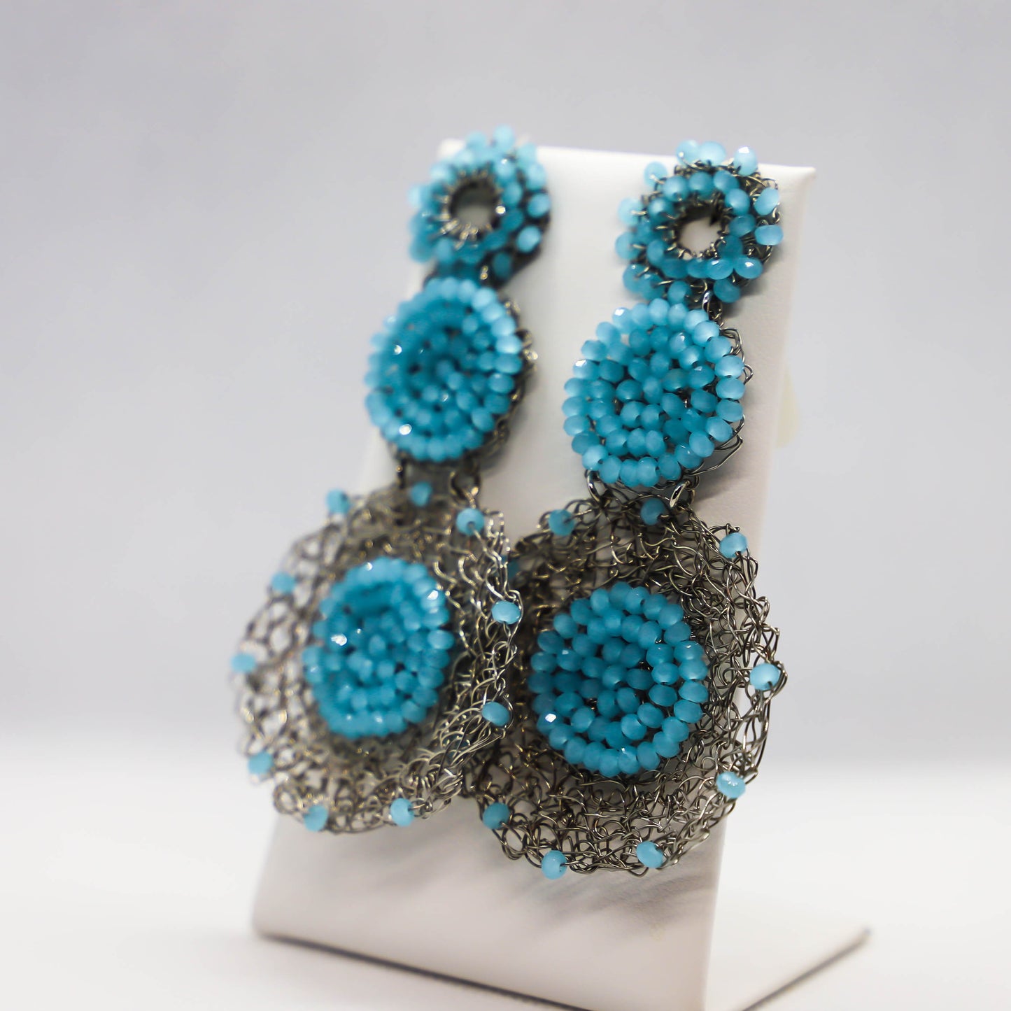 Hand crocheted circle drop earrings with light blue crystal accents