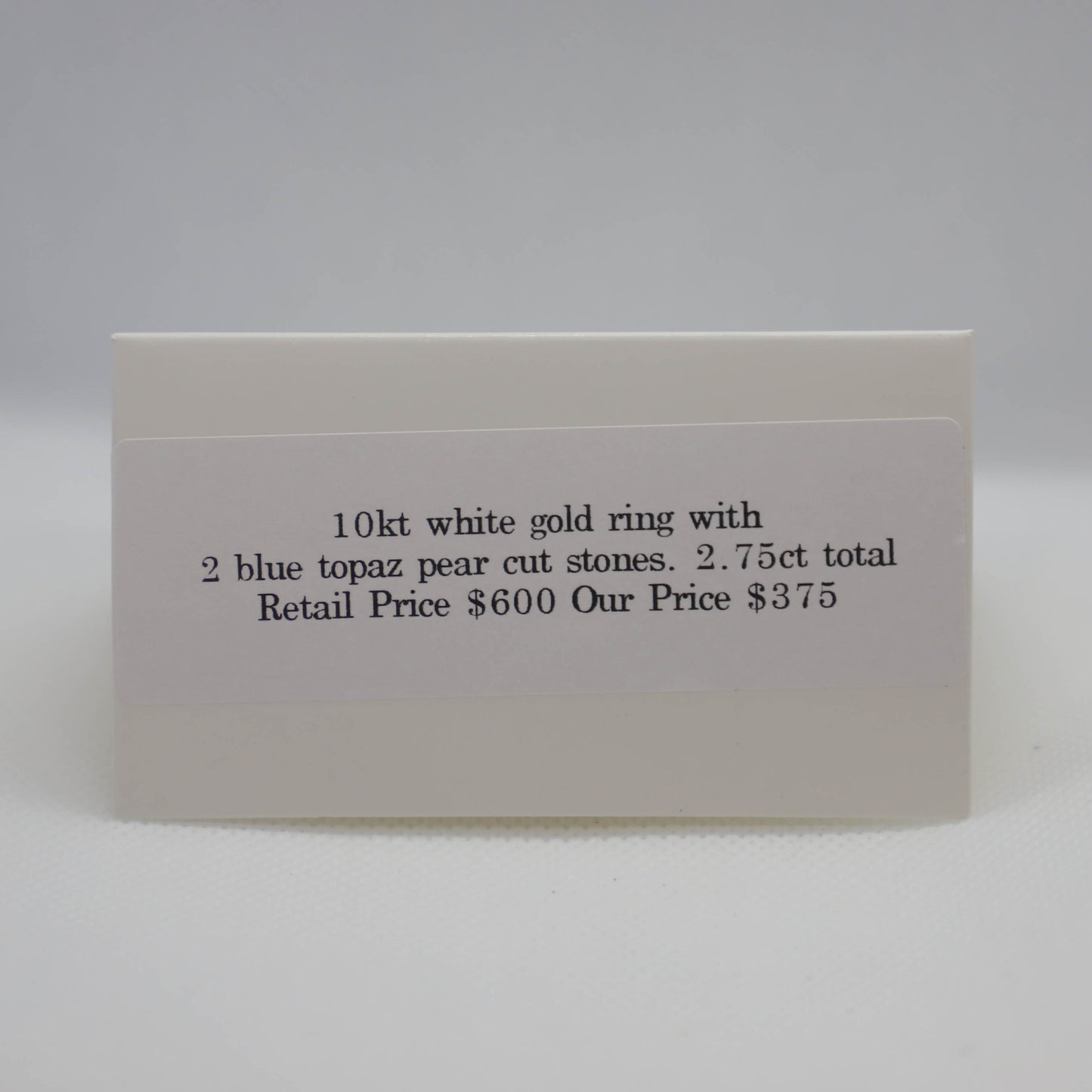 White gold, pear shaped blue topaz ring