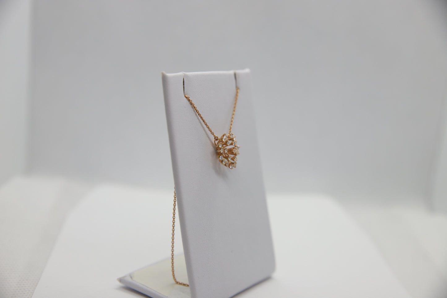 Rose gold cluster pendant
