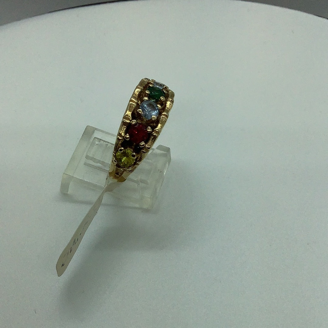 Gold band with simulated gemstones