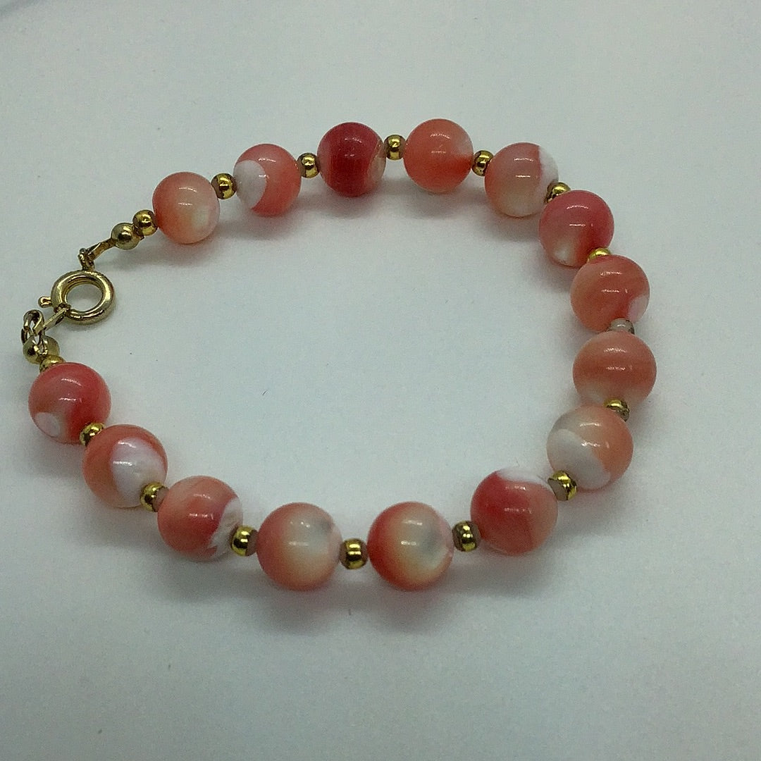 Coral toned Shell bead bracelet
