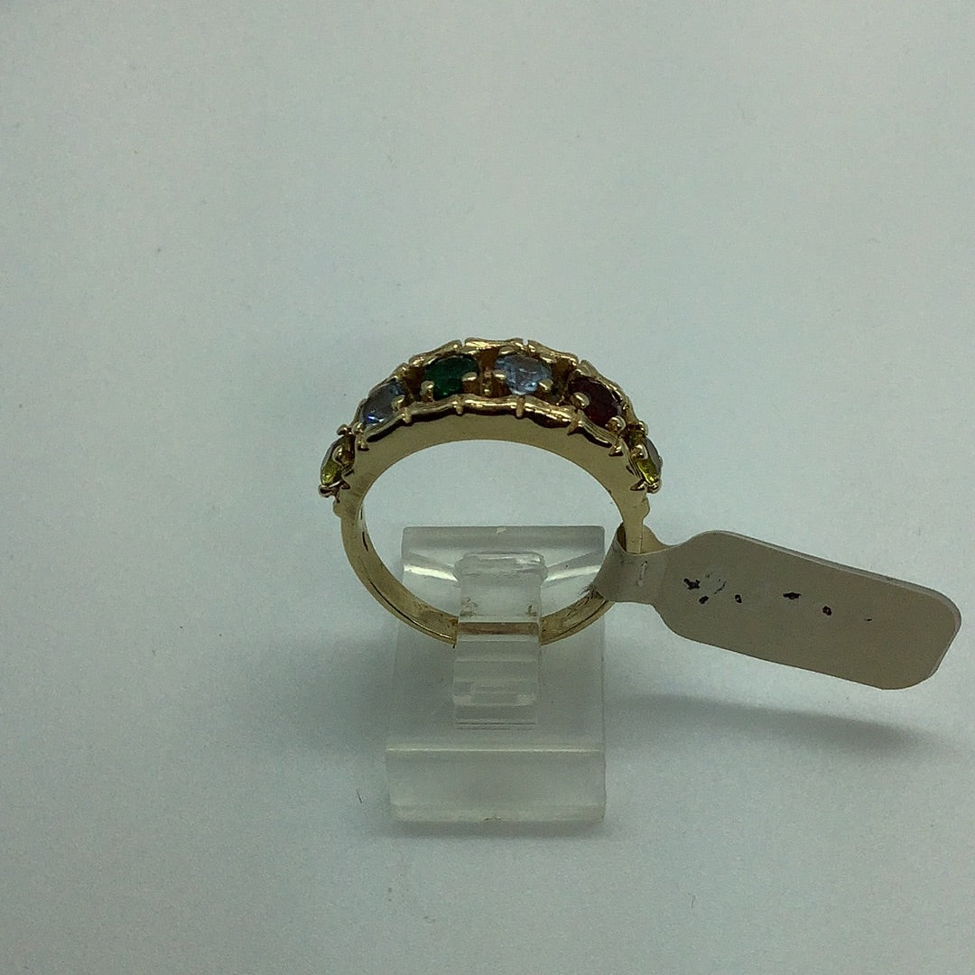 Gold band with simulated gemstones