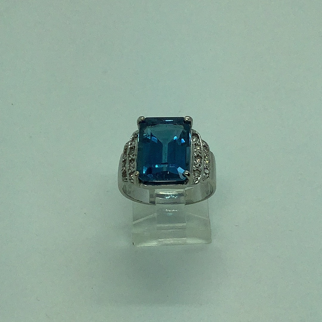 Emerald cut blue topaz ring