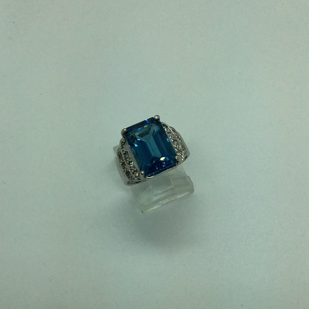Emerald cut blue topaz ring