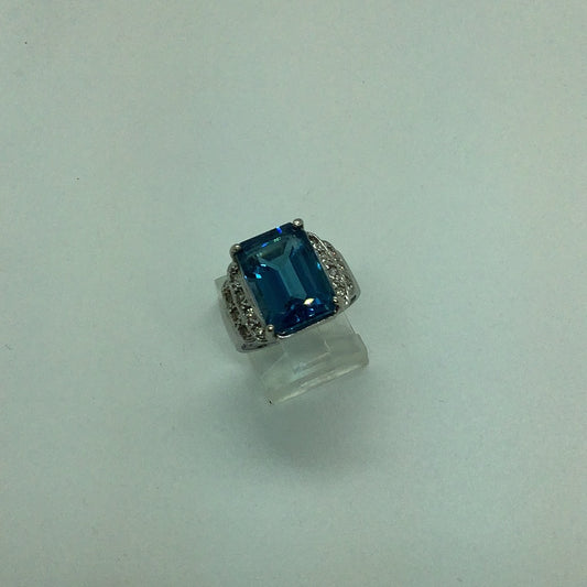 Emerald cut blue topaz ring