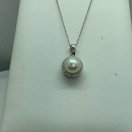 Pearl and diamond pendant