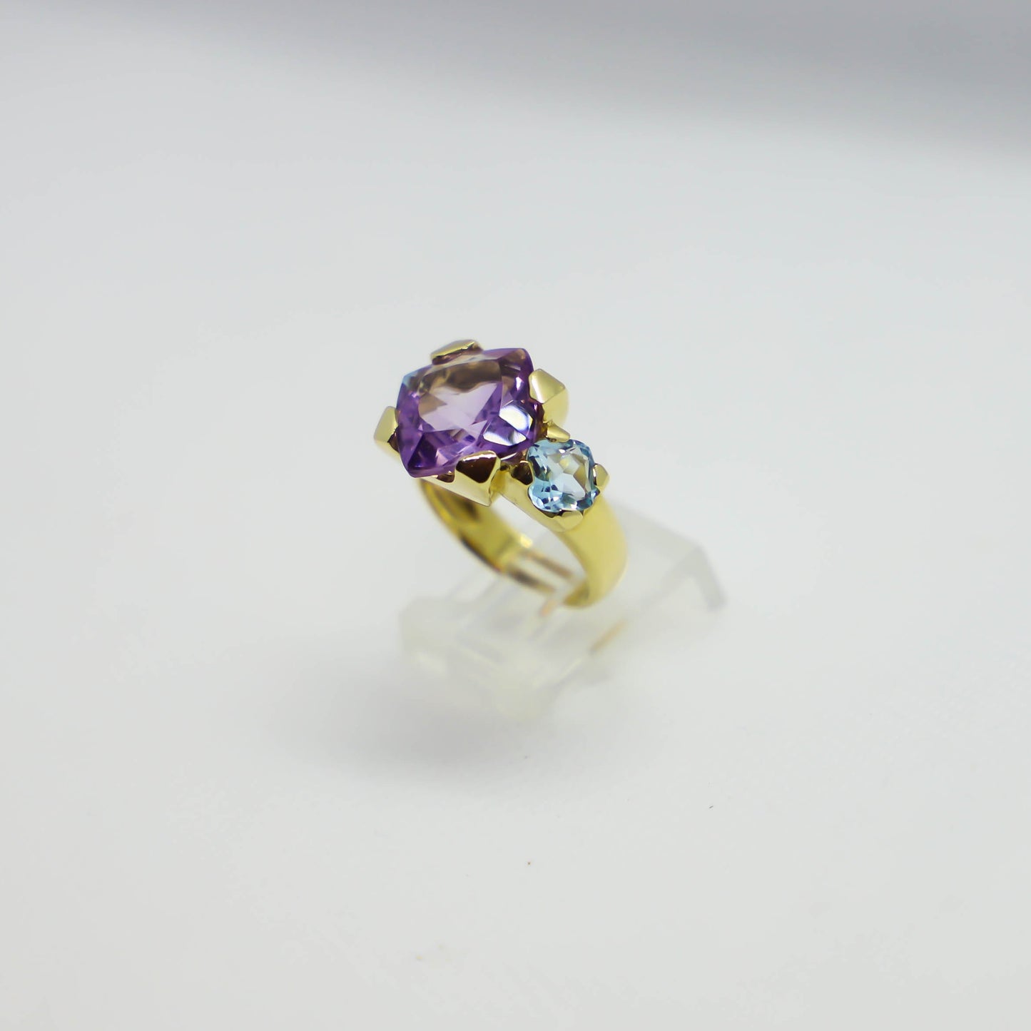 Yellow gold amethyst and blue topaz ring