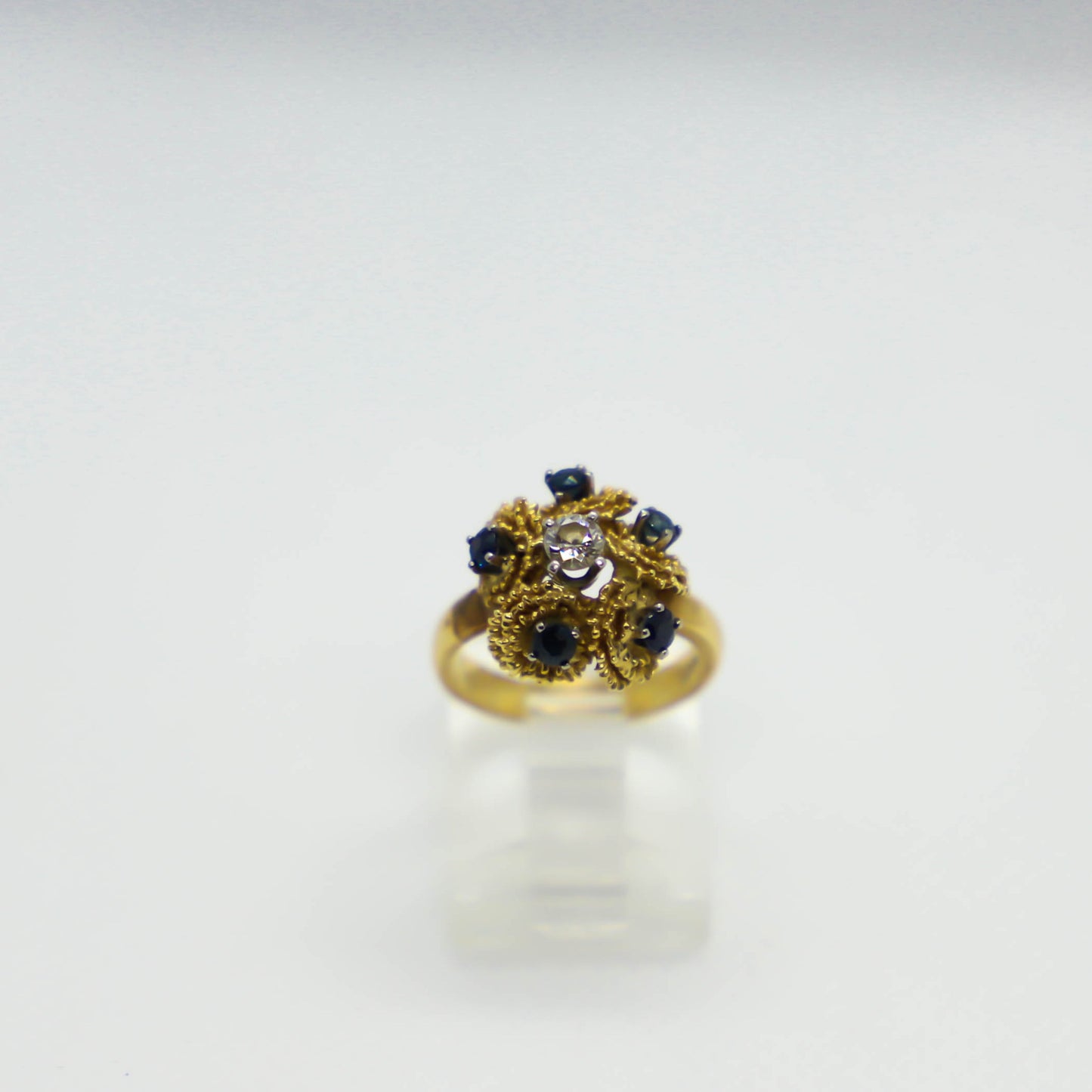 Yellow gold sapphire and diamond cluster ring