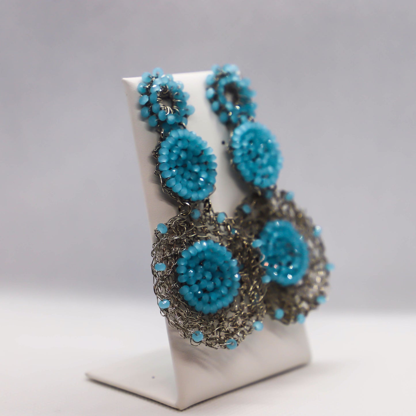 Hand crocheted circle drop earrings with light blue crystal accents