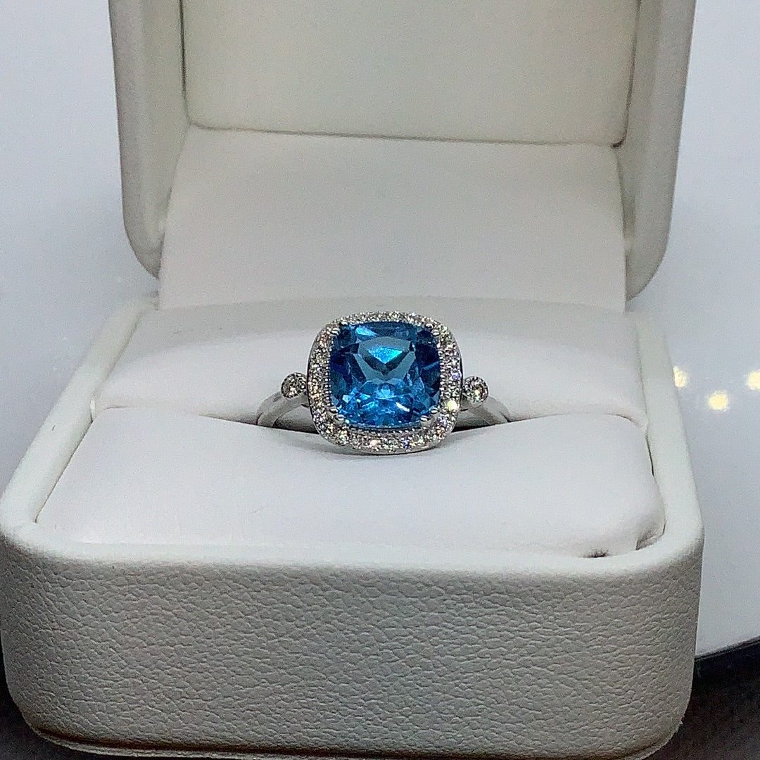 Blue topaz and diamond ring